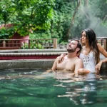 Couple relaxing in the hot springs at Borinquen Mountain Resort & Spa in Guanacaste, Costa Rica