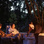 Couple enjoying wine by the firepit at Koora Boutique Hotel in Monteverde, Costa Rica.