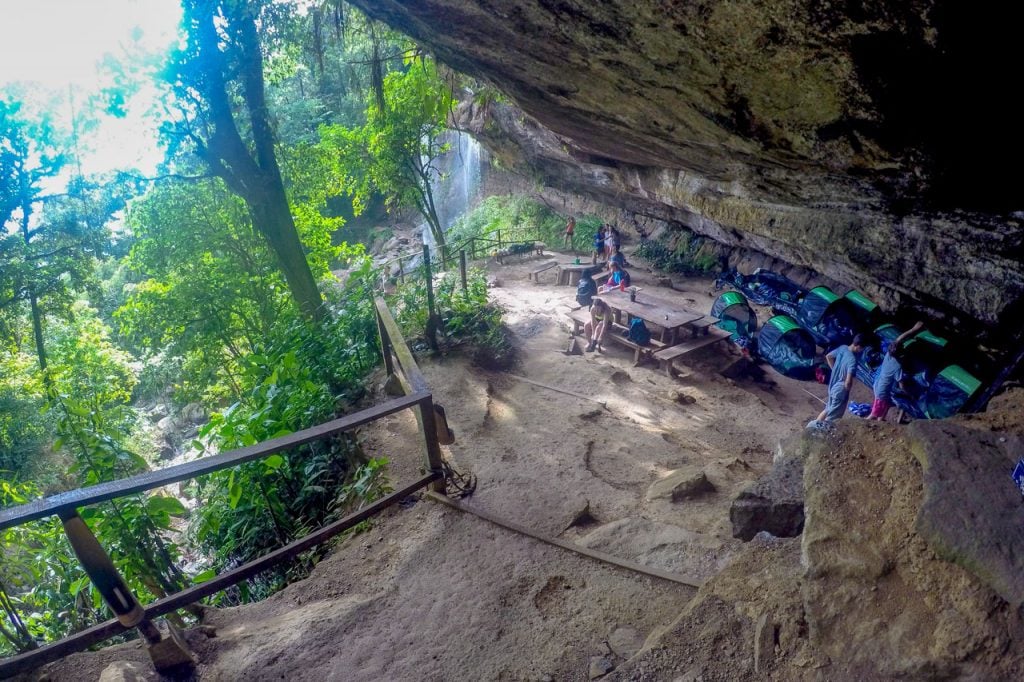 Rainforest Waterfall Cave Camp