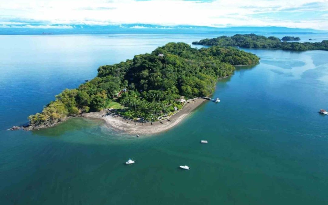 Aerial view of Isla Chiquita in Paquera, Costa Rica, surrounded by the calm waters of the Nicoya Gulf.