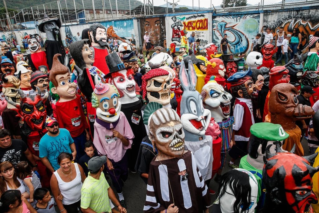 Giant costumed puppets march in Costa Rica's streets to celebrate the Mascarada.