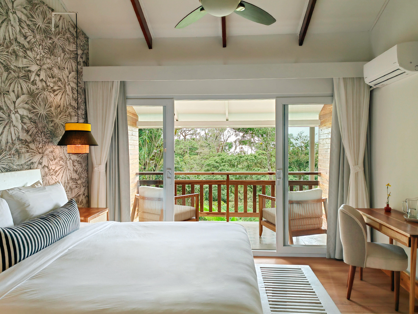 Enjoy rooms surrounded by lush designer gardens at Monteverde Lodge & Gardens.