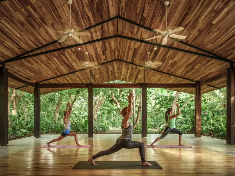 yoga-retreat-tamarindo-costa-rica-jungle-pavilion.png open-air yoga class in wooden jungle pavilion near tamarindo costa rica