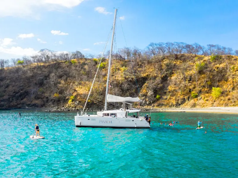 catamaran-tour-snorkeling-paddleboard-tamarindo-costa-rica.png catamaran with snorkelers and paddleboarders near tamarindo costa rica