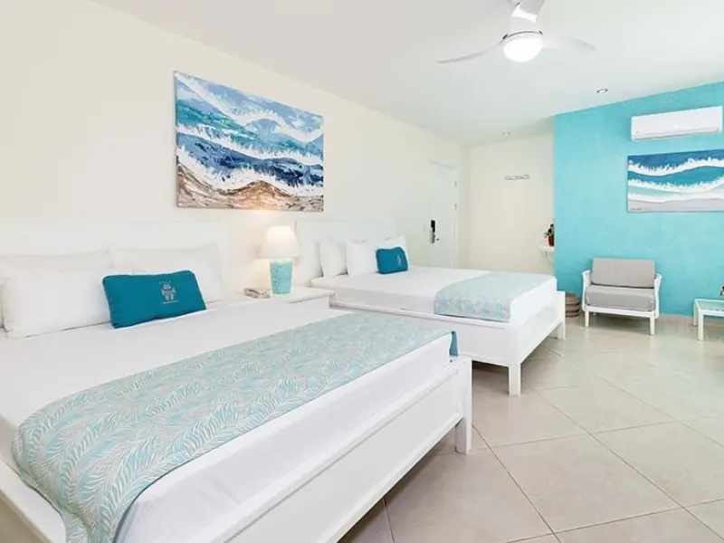 tamarindo-costa-rica-hotel-room-blue-decor.png modern hotel room with blue decor and twin beds in tamarindo costa rica