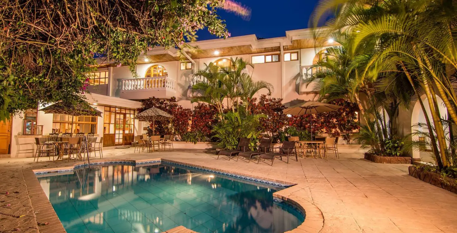 Pool and tropical gardens at Buena Vista Chic Hotel in Alajuela, Costa Rica.