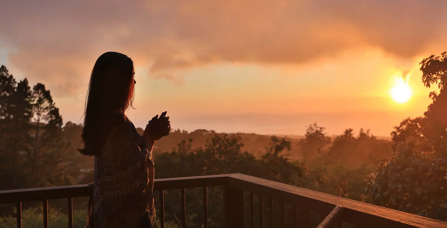 Woman enjoying a sunset view near Arenal Volcano in Costa Rica