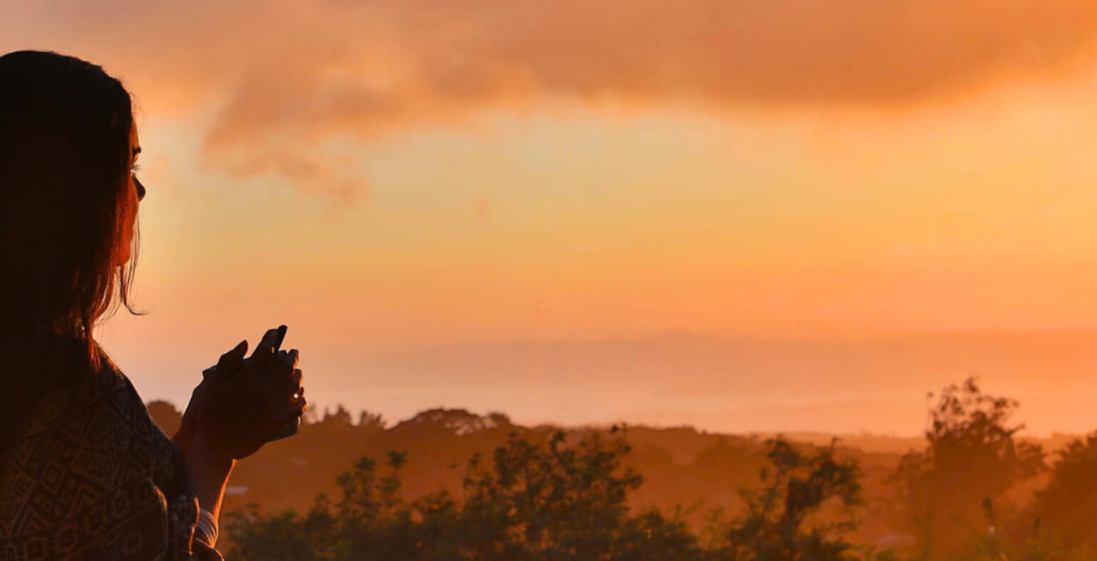 Traveler enjoying a Costa Rica sunset view from a scenic overlook